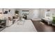 Bright living room with hardwood floors, a comfortable couch, and natural light at 1653 S Logan St, Denver, CO 80210