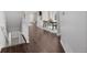 Bright living room features hardwood floors and a dining area at 1653 S Logan St, Denver, CO 80210