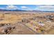 Scenic aerial shot of the property nestled in a rural landscape with mountain views in the distance at 200 Bothun Rd, Berthoud, CO 80513