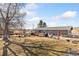 Spacious backyard with a patio area and an expansive lawn at 200 Bothun Rd, Berthoud, CO 80513