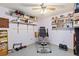 Well-lit basement space with exercise equipment and built-in shelves at 200 Bothun Rd, Berthoud, CO 80513