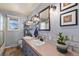 Bright bathroom with double vanity, modern fixtures, tile backsplash, and natural light from a window at 200 Bothun Rd, Berthoud, CO 80513