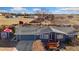 Charming home featuring mature landscaping, a cozy front porch and attached two-car garage at 200 Bothun Rd, Berthoud, CO 80513