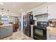 Modern kitchen with stainless steel appliances and gray cabinets, next to a dining area at 200 Bothun Rd, Berthoud, CO 80513