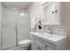 Clean bathroom featuring a glass-enclosed shower, white vanity, and modern fixtures at 103 Sunset St # A, Longmont, CO 80501