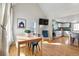 Dining area with lots of sunlight and view to kitchen with white cabinetry at 103 Sunset St # A, Longmont, CO 80501