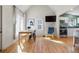 Dining area with lots of sunlight and view to kitchen with white cabinetry at 103 Sunset St # A, Longmont, CO 80501