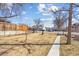 Spacious front yard with well-maintained lawn and mature trees, offering great curb appeal at 103 Sunset St # A, Longmont, CO 80501