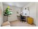 Well-lit office space with a desk, chair, and yellow storage cabinet, perfect for working from home at 103 Sunset St # A, Longmont, CO 80501