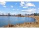 Tranquil view of a pond with clear blue water and natural shoreline landscape at 103 Sunset St # A, Longmont, CO 80501