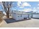 Rear exterior showcasing modern siding and a convenient paved parking area at 103 Sunset St # A, Longmont, CO 80501