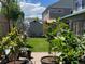 Landscaped backyard features lush greenery, a small storage shed, and patio space at 18090 E 47Th Dr, Denver, CO 80249