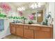 Bathroom featuring double sinks, spacious countertop and shower at 18090 E 47Th Dr, Denver, CO 80249