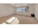Spacious bedroom with neutral carpet, ample natural light, and window blinds at 18090 E 47Th Dr, Denver, CO 80249