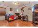 Bright bedroom with fun wall decals, laminate floors, ceiling fan, and a cozy bed at 18090 E 47Th Dr, Denver, CO 80249