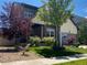 Attractive two-story home with well-manicured lawn and mature landscaping at 18090 E 47Th Dr, Denver, CO 80249