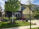 Charming two-story home with well-maintained lawn and front yard landscaping at 18090 E 47Th Dr, Denver, CO 80249