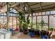 Bright greenhouse with lush plants, natural light, and wooden frame at 18090 E 47Th Dr, Denver, CO 80249