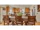 Open kitchen and dining area with granite counters, wood cabinets and stainless steel appliances at 18090 E 47Th Dr, Denver, CO 80249