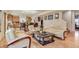 Open-concept living area blending seamlessly into the kitchen with ample seating at 18090 E 47Th Dr, Denver, CO 80249