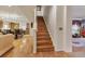 View of the wooden staircase connecting the home's living spaces at 18090 E 47Th Dr, Denver, CO 80249