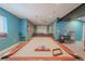 Finished basement with a pool table, movie screen, and comfortable seating area at 1586 S Goldbug Cir, Aurora, CO 80018