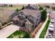 Aerial view of a two-story home with a well-manicured lawn at 1586 S Goldbug Cir, Aurora, CO 80018