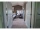 View into main bedroom with vaulted ceiling, neutral paint, and a sitting area next to the window at 1586 S Goldbug Cir, Aurora, CO 80018