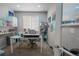 Home office features desk, chair, printer, shelving and playful wall decor at 1586 S Goldbug Cir, Aurora, CO 80018