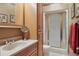 Bathroom featuring vanity, shower, toilet, and storage at 3557 Palmer Ridge Dr, Parker, CO 80134