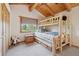 Bedroom with bunk beds, wood ceiling, and ample natural light at 3557 Palmer Ridge Dr, Parker, CO 80134
