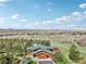 An inviting wooded home features a lush lawn, attached garage, and beautiful landscaping at 3557 Palmer Ridge Dr, Parker, CO 80134