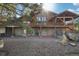 The cabin home has a stone foundation with exterior access and a lovely natural landscape at 3557 Palmer Ridge Dr, Parker, CO 80134