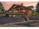 The luxurious cabin features a combination of stone and wood, and has multiple decks for outdoor enjoyment at 3557 Palmer Ridge Dr, Parker, CO 80134