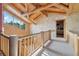 Hallway with wood finishes and detailing, bright light, and a view of the beautiful outdoors at 3557 Palmer Ridge Dr, Parker, CO 80134