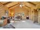 Relaxing living room featuring a vaulted wooden ceiling, leather furniture, and multiple windows at 3557 Palmer Ridge Dr, Parker, CO 80134