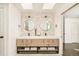 Bathroom featuring double sinks, modern lighting, and a large mirror at 40 S Dexter St, Denver, CO 80246