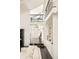 Bright foyer boasting an open floor plan and staircase with wrought iron railing at 40 S Dexter St, Denver, CO 80246