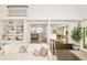 Open-concept living space leading to kitchen and dining area with natural light at 40 S Dexter St, Denver, CO 80246