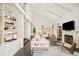 Bright, open living room with vaulted ceilings, built-in shelving, and a fireplace at 40 S Dexter St, Denver, CO 80246