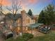 Aerial view of a home with a large backyard, covered patio, and mature trees at 5034 E Otero Cir, Centennial, CO 80122