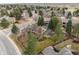 Aerial view of the home with a large backyard including covered patio and play structure at 5034 E Otero Cir, Centennial, CO 80122