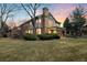 Large home with a brick chimney, and a covered patio in a big backyard at 5034 E Otero Cir, Centennial, CO 80122