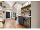 Stylish bar area with wine fridge and ample storage, perfect for entertaining at 5034 E Otero Cir, Centennial, CO 80122