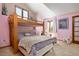 Cozy bedroom features bunk bed, lots of natural light, and fun decor at 5034 E Otero Cir, Centennial, CO 80122