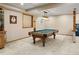 Finished basement with billiard table and classic lighting at 5034 E Otero Cir, Centennial, CO 80122