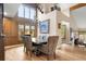 Elegant dining room with soaring ceilings, a chandelier, and abundant natural light at 5034 E Otero Cir, Centennial, CO 80122