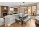 Bright dining room features a fireplace, hardwood floors, and views to the front yard at 5034 E Otero Cir, Centennial, CO 80122