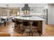Gourmet kitchen with a large island, modern appliances, and bar stool seating at 5034 E Otero Cir, Centennial, CO 80122
