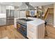 Bright kitchen features stainless steel appliances, an island with cooktop, and a stone countertop at 5034 E Otero Cir, Centennial, CO 80122